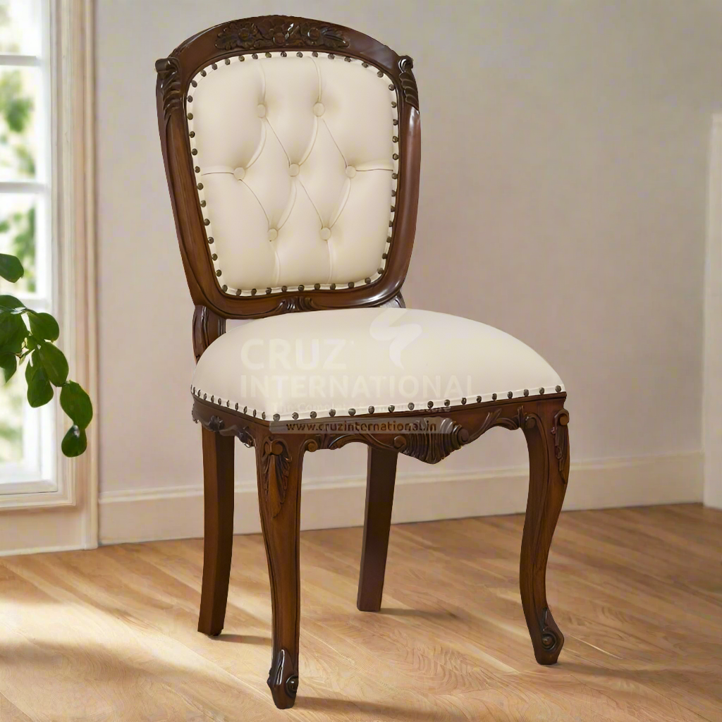 A traditional dining chair with a tufted backrest and a round, upholstered seat cushion in a carved wooden frame on a hardwood floor.